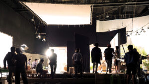 silhouette of people working in big production stu Envato